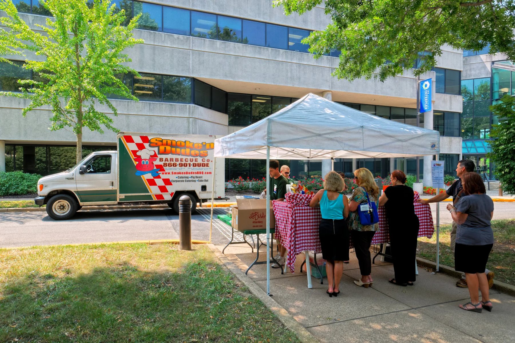 Tenants at a food truck lunch outside an Interplex building