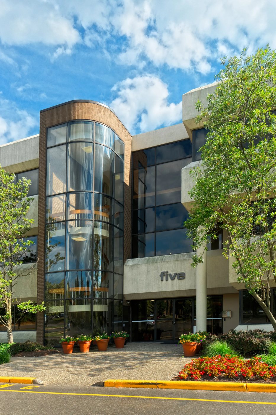 The glass stair tower and entrance of Building Five